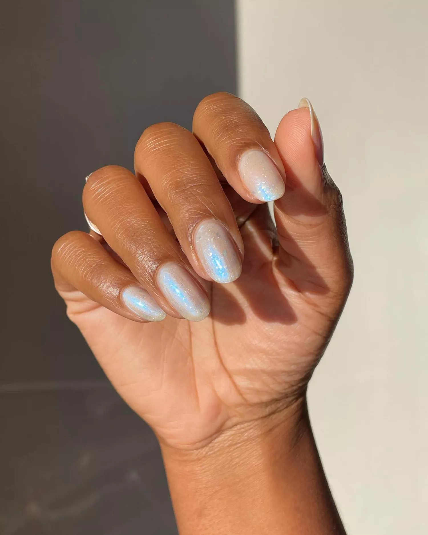 An iridescent "glazed donut" manicure