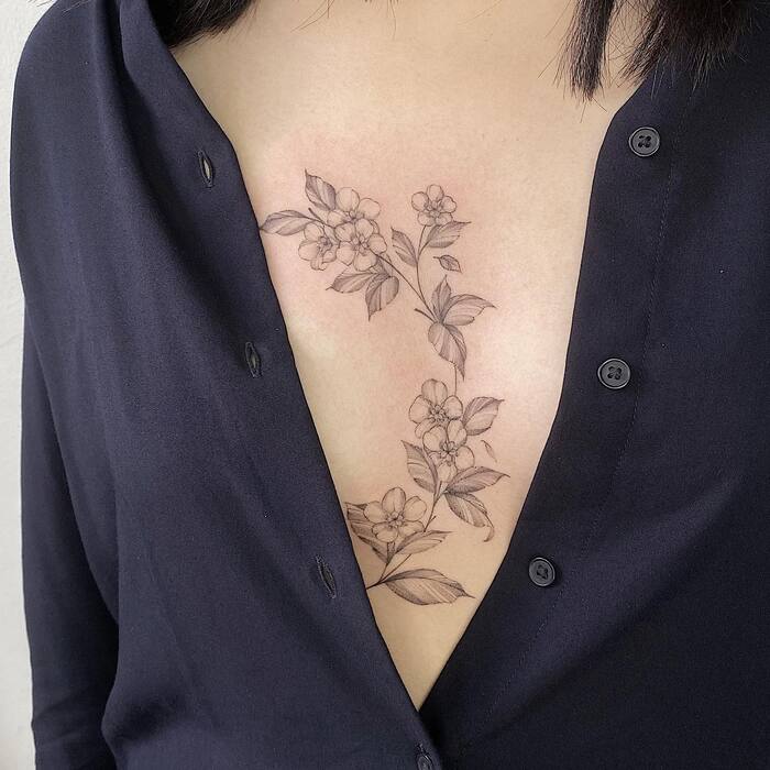 Feminine Sternum Tattoo