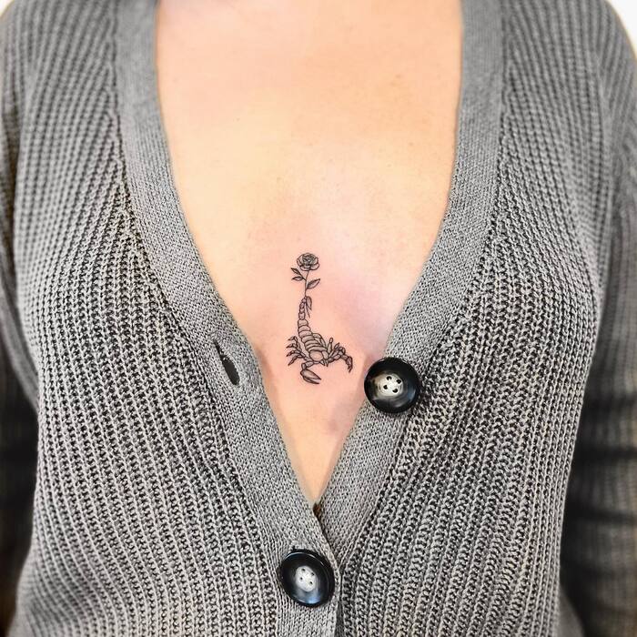 Small Scorpio Tattoo On Sternum