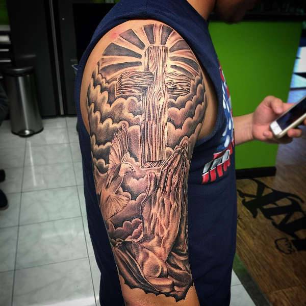 cross with praying hands tattoo