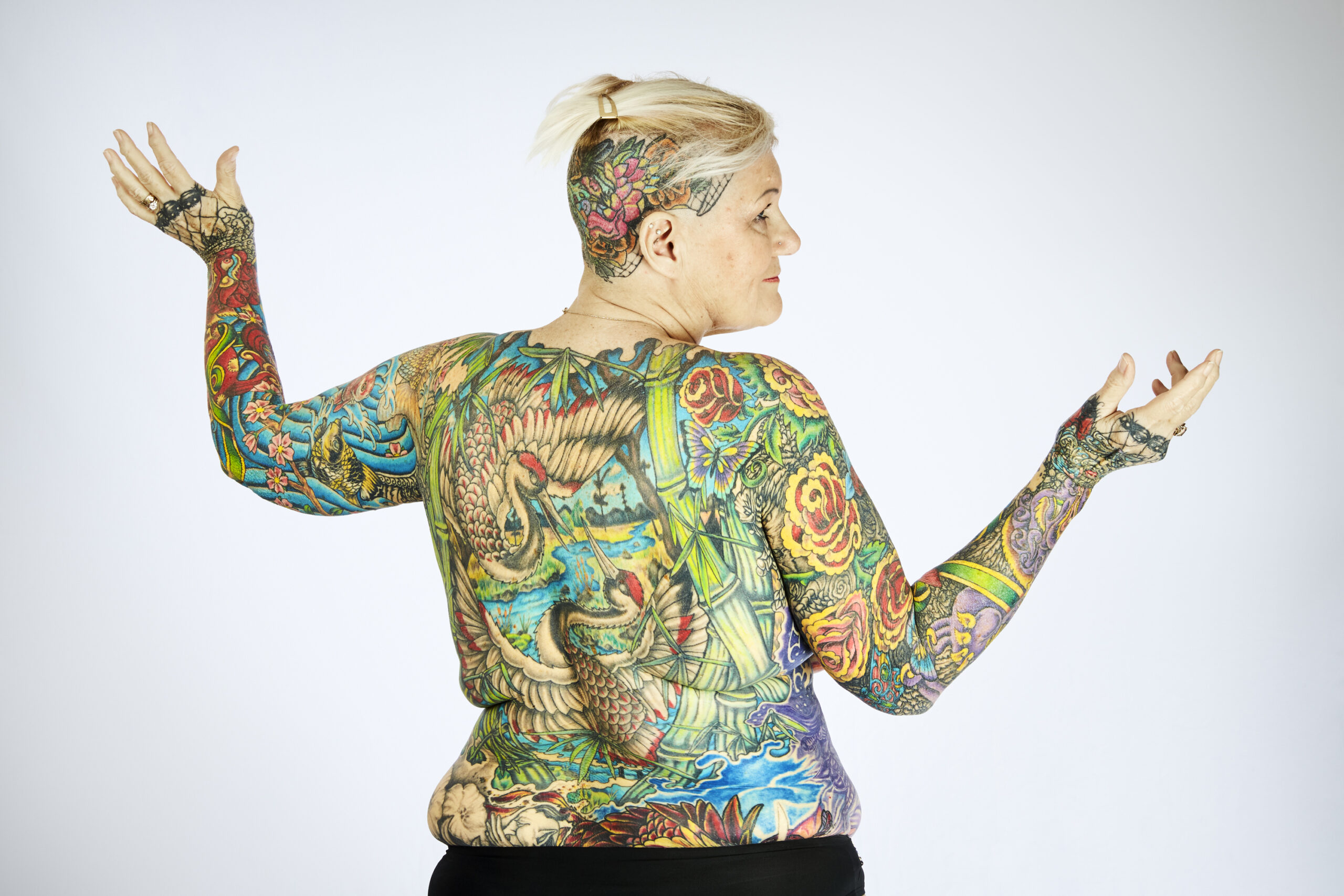 I'm the most tattooed woman in the world with 98% of my body covered –  after getting my first inking at 50 | The US Sun