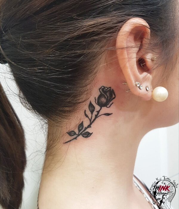 Single rose back of the neck tattoo