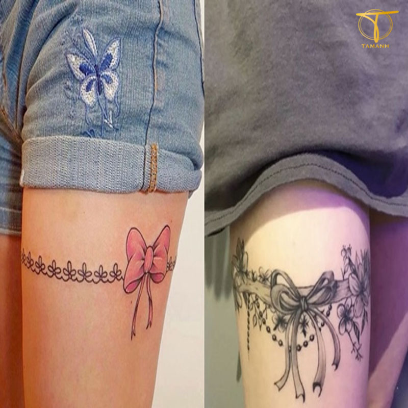 Bow thigh tattoo