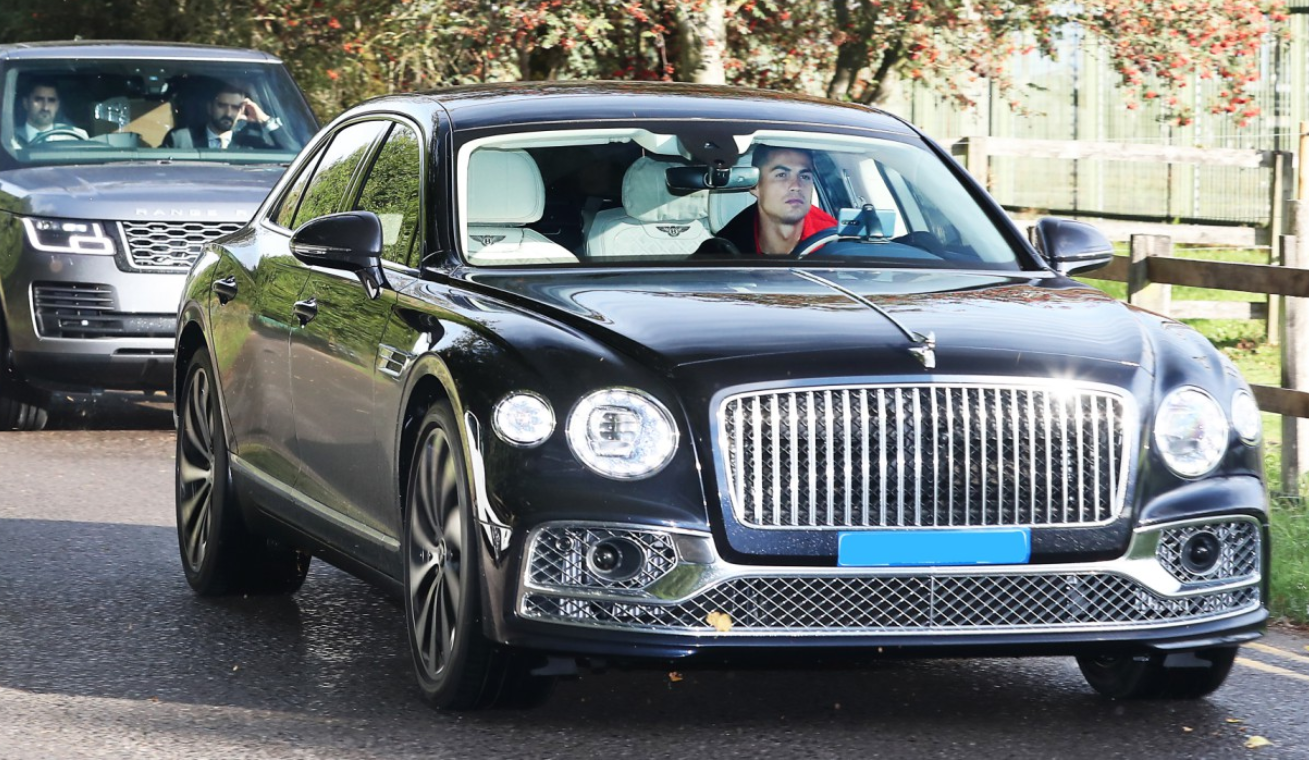 Cristiano Ronaldo drives his Bentley Flying Spur to training with Manchester United