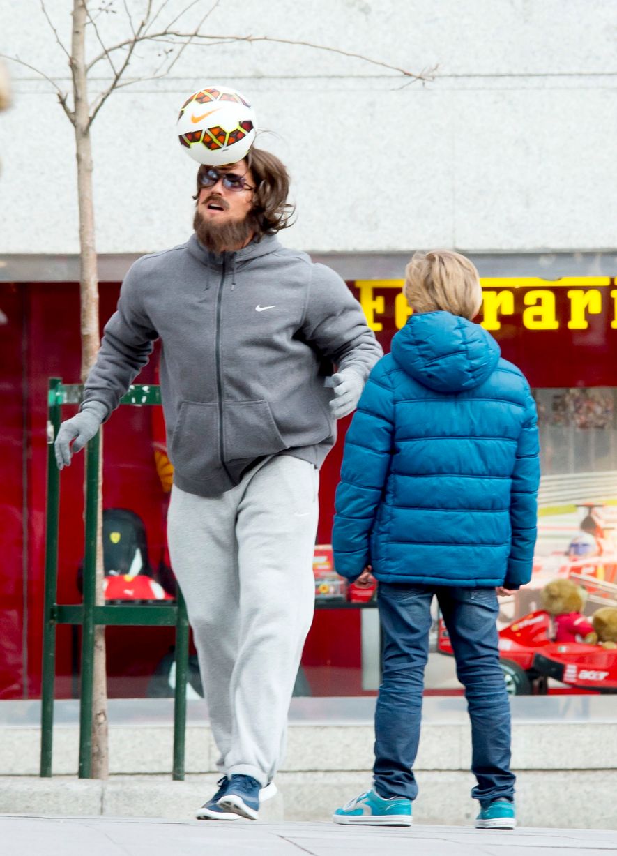 Cristiano Ronaldo, disguised as beggar, plays football with young boy in  Madrid square - Mirror Online