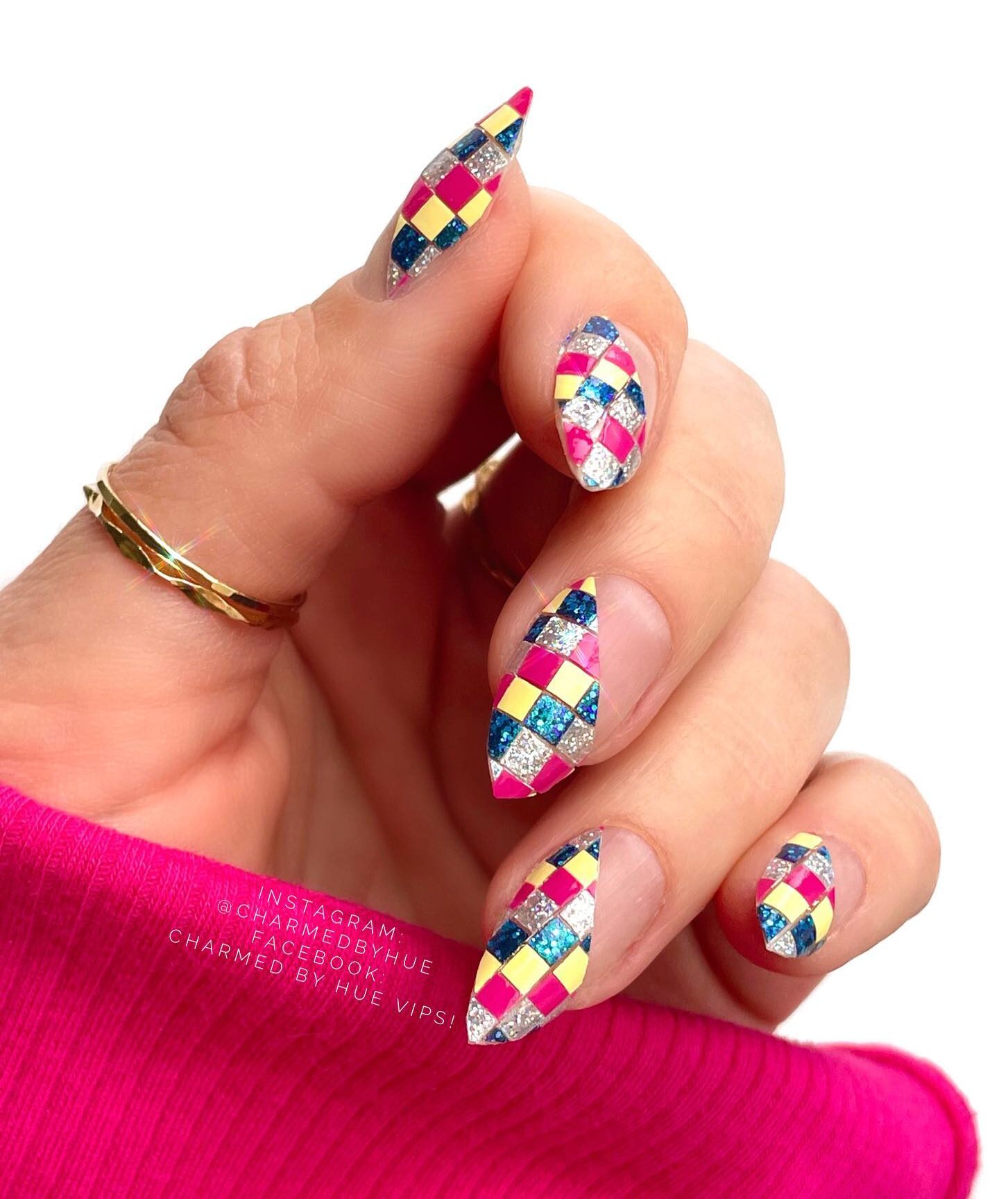 Multicolored checkered nail art with glitters on medium stiletto nails