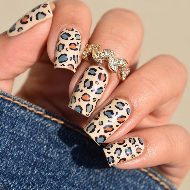 Beige Cheetah Nails with Pops of Navy Blue