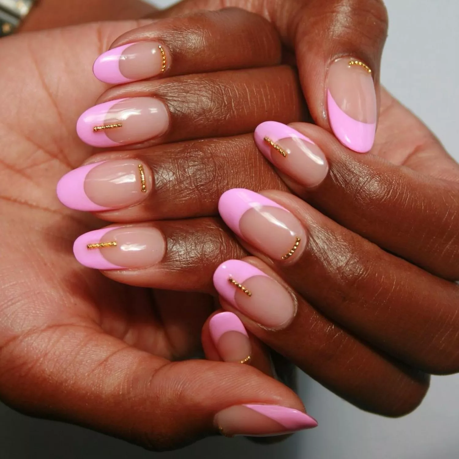 Bubblegum pink French tips with gold accents