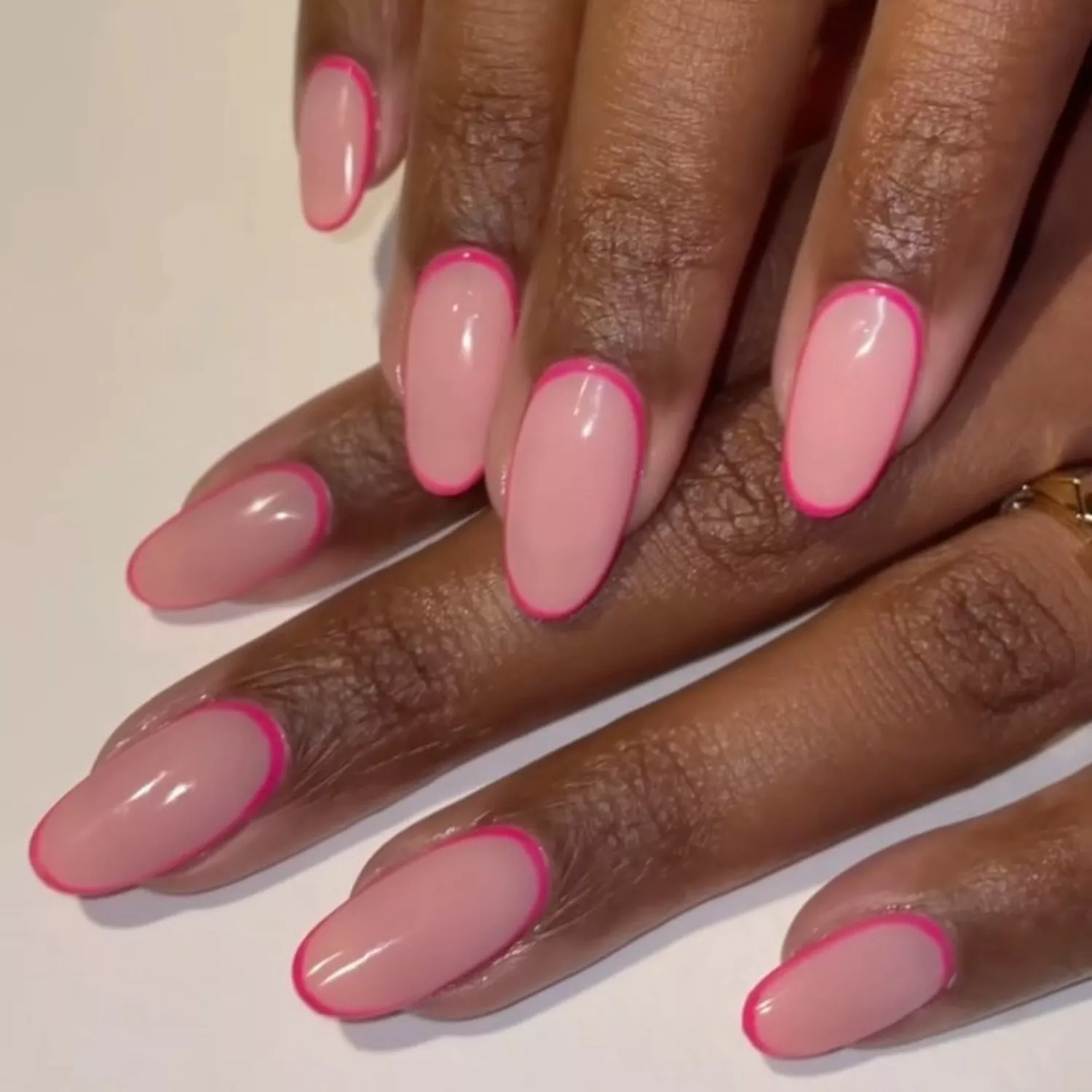 Nude nails with hot pink outline