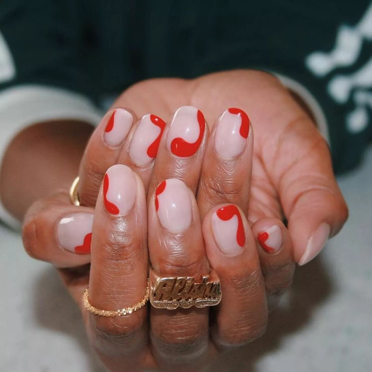 Red squiggle border nails