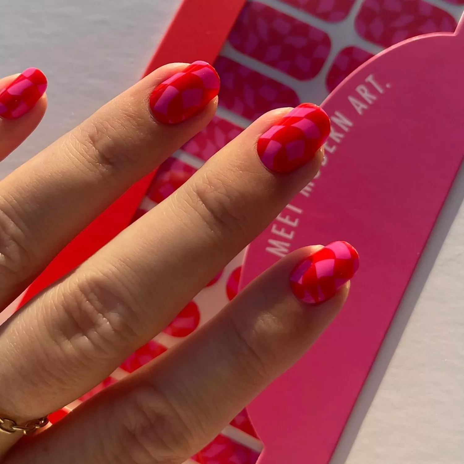 Pink and red checker manicure