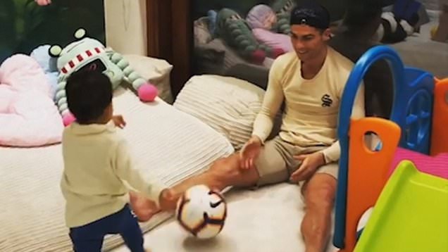 Cristiano Ronaldo's toddler son Mateo follows in his footsteps as he teaches him football skills | Daily Mail Online