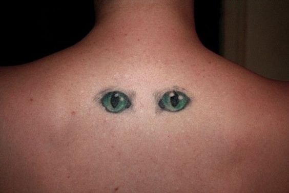 cat face tattoo back