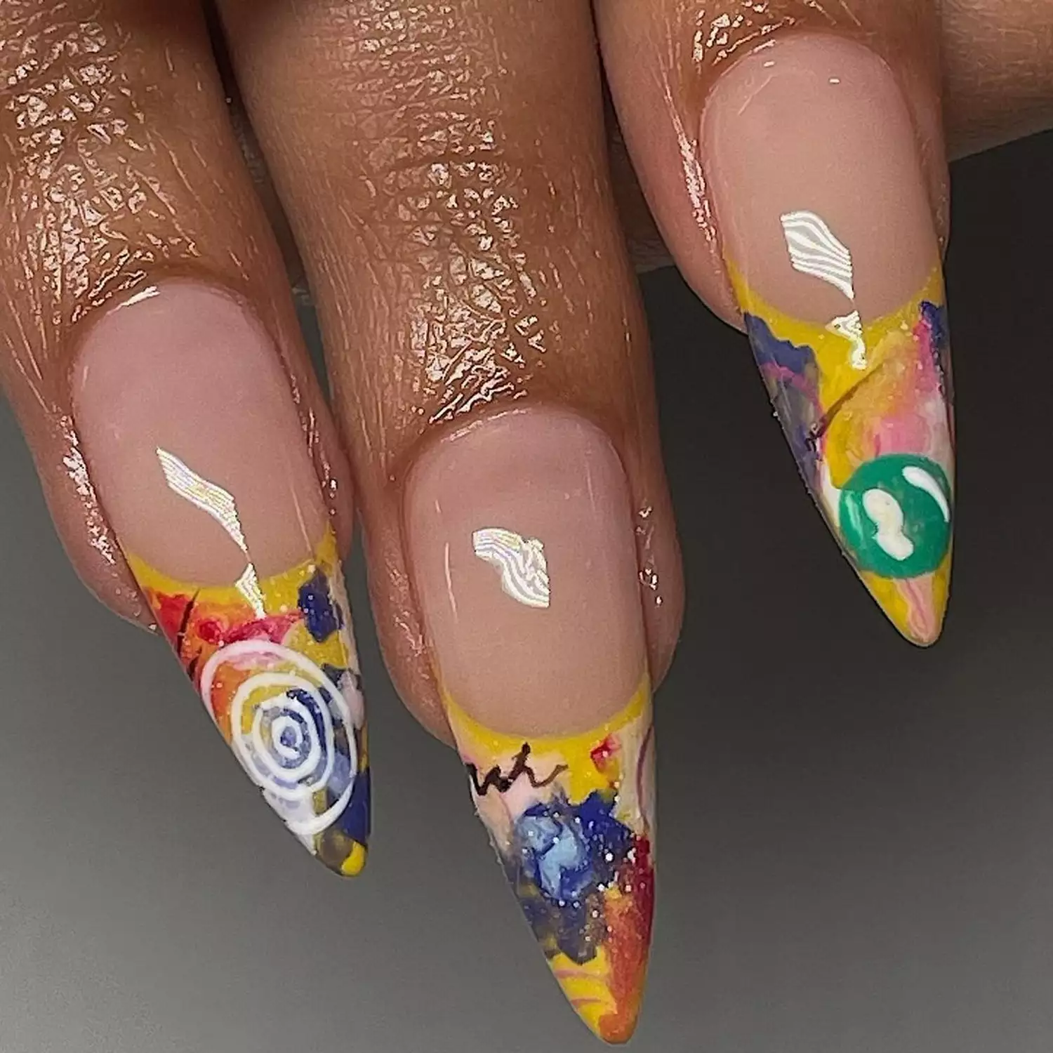 a manicure with artistic canvas tips