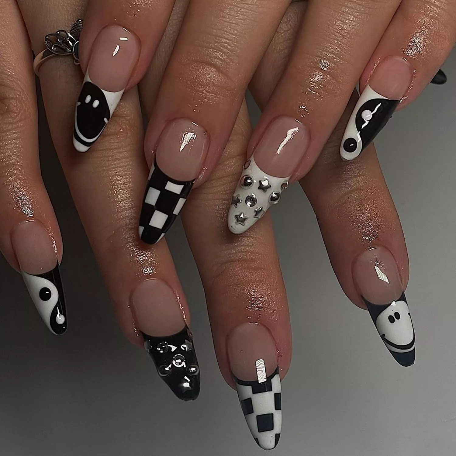 a black and white mismatched design manicure