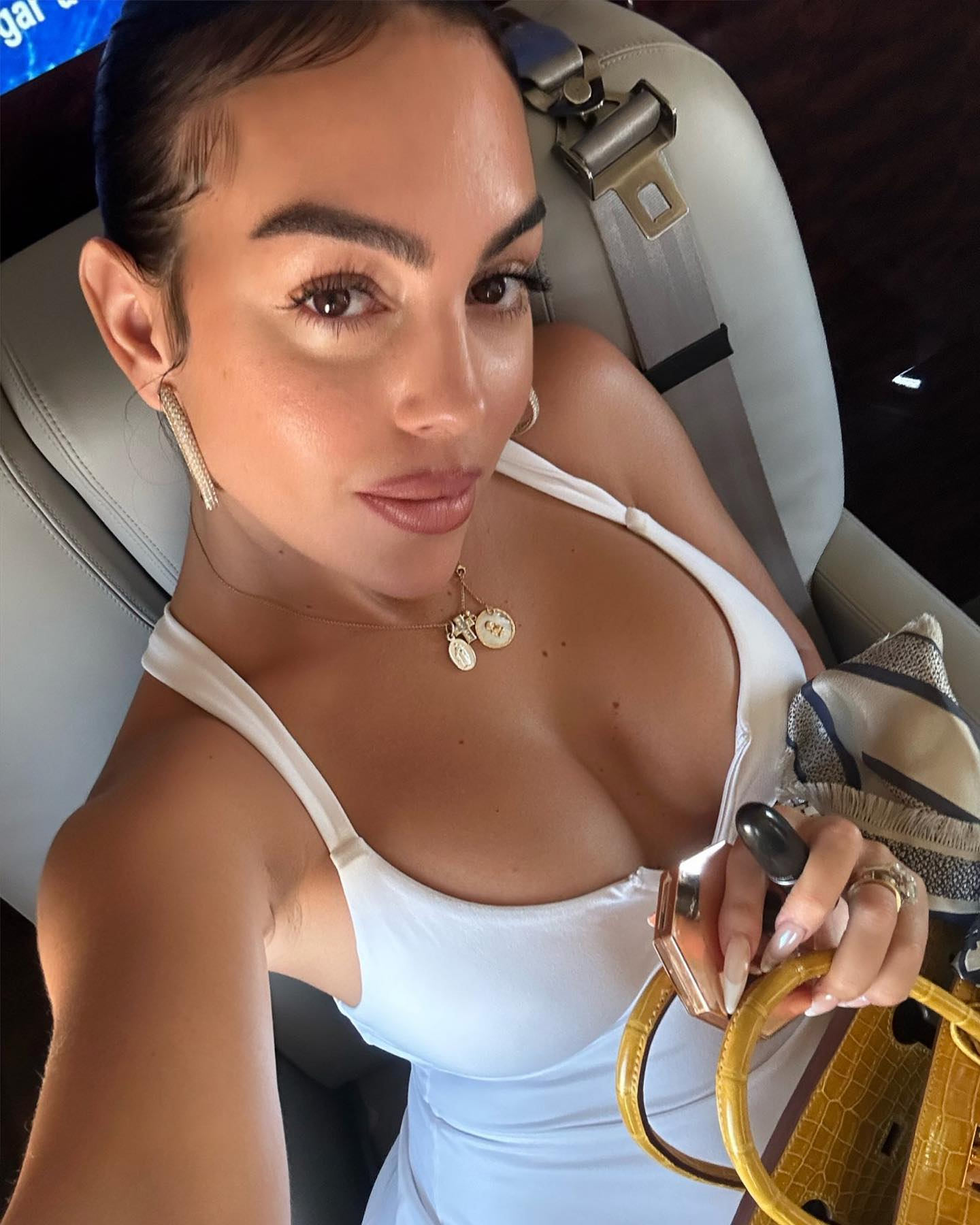 Inside Georgina Rodriguez's private jet as Cristiano Ronaldo's girlfriend puts on busty display in short white dress | The US Sun