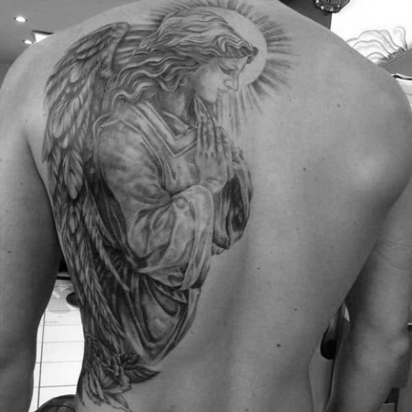 Black and grey praying guardian angel tattoo