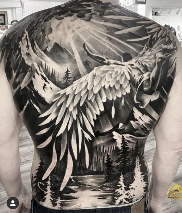 Flying Guardian angel back tattoo