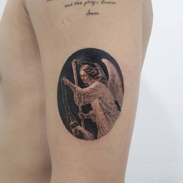 Guardian angel circle tattoo