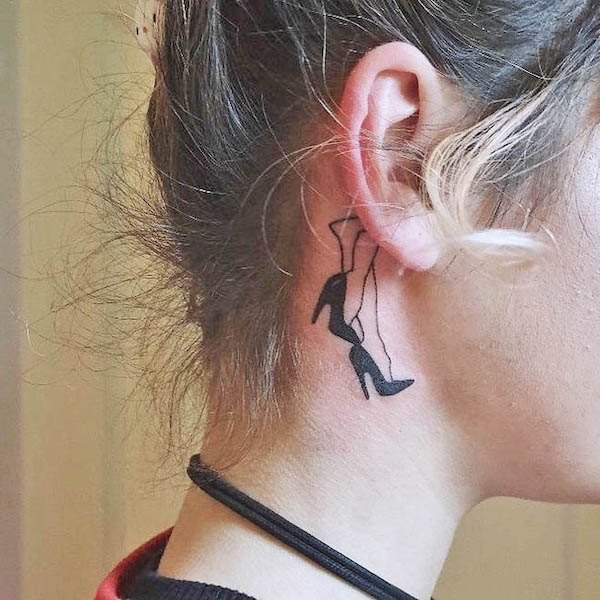 HIgh heels tattoo behind the ear by @tattsforbrats