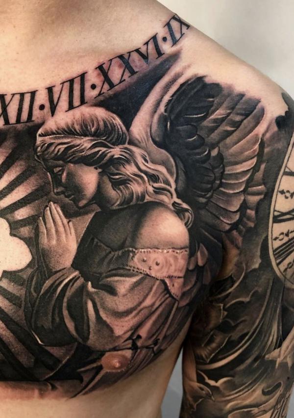 Praying Guardian angel tattoo chest