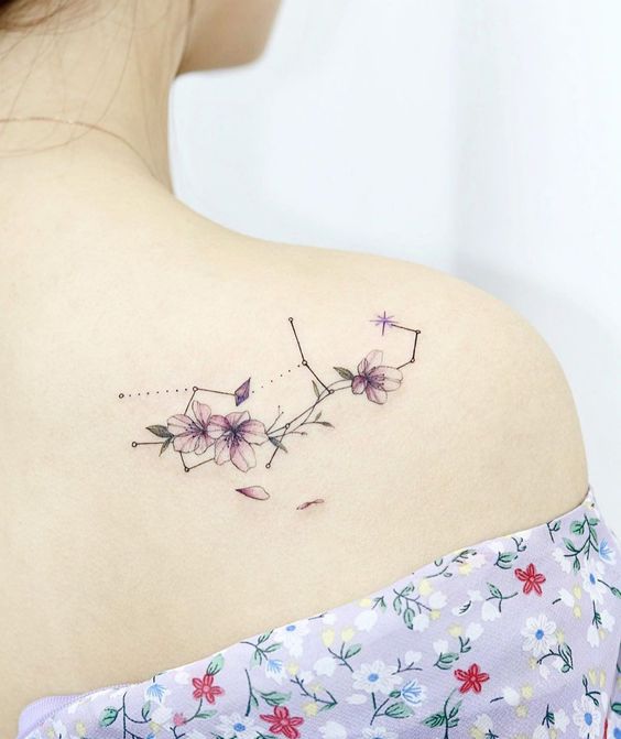 Floral Virgo constellation tattoo on the shoulder
