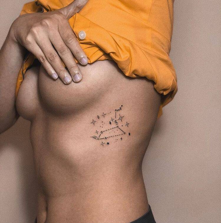 Leo constellation tattoo on the left side ribcage