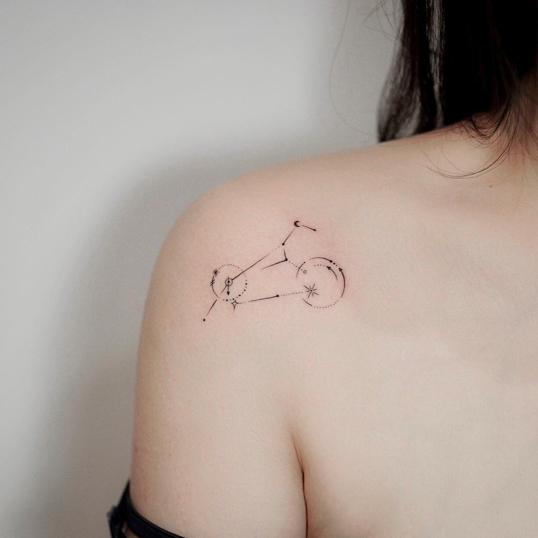 Fine line Leo constellation tattoo located on the shoulder