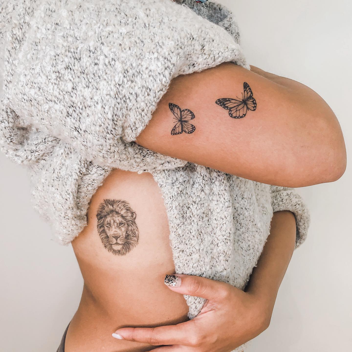 Micro-realistic lion portrait tattoo on the right ribcage