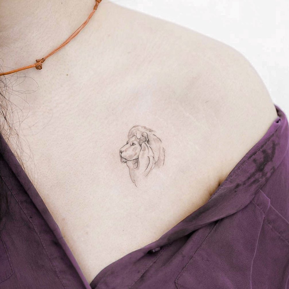 Minimalistic lion tattoo on the chest