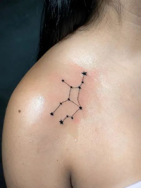Minimalist Virgo constellation tattoo on the right shoulder