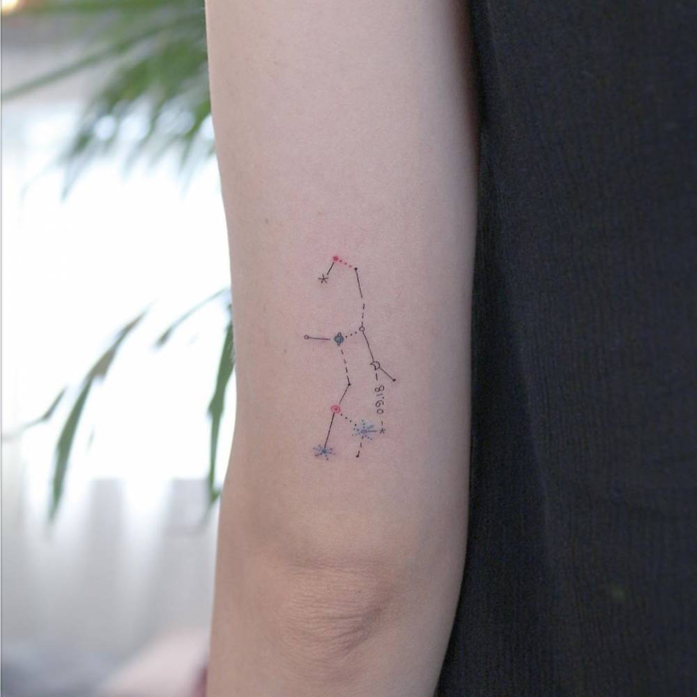 Fine line Virgo constellation tattoo on the outer arm