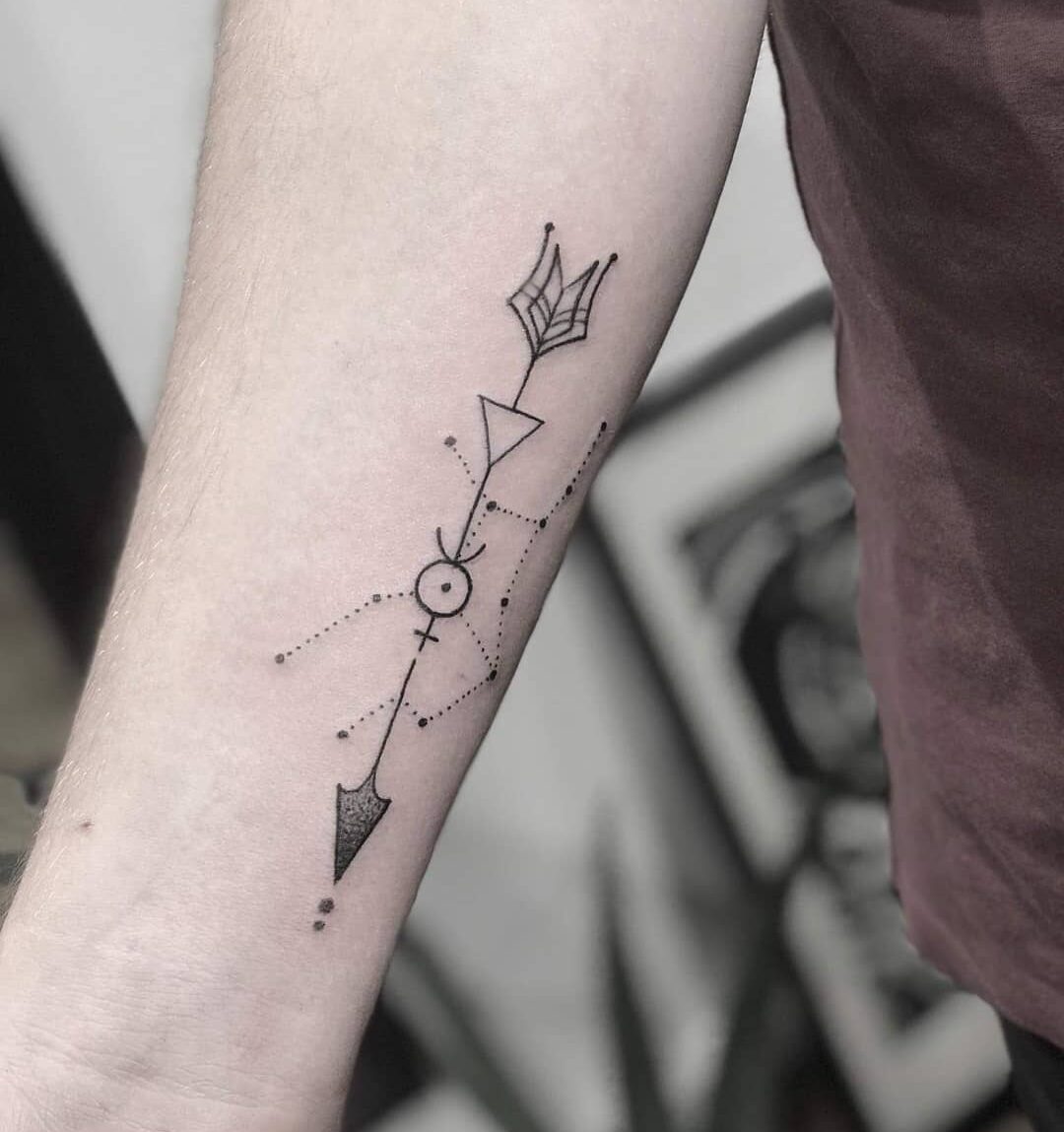 Virgo constellation and tribal arrow tattoo on the inner forearm