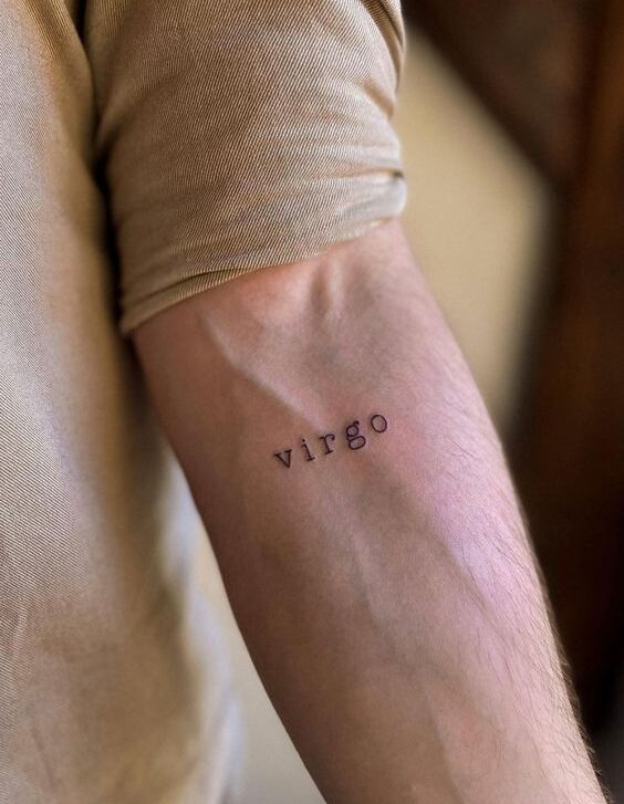 Virgo lettering tattoo on the inner forearm