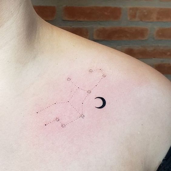 Virgo constellation and crescent moon tattoo on the shoulder