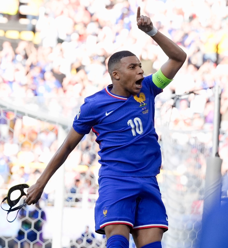 a soccer player wearing a blue jersey with the number 10 on it