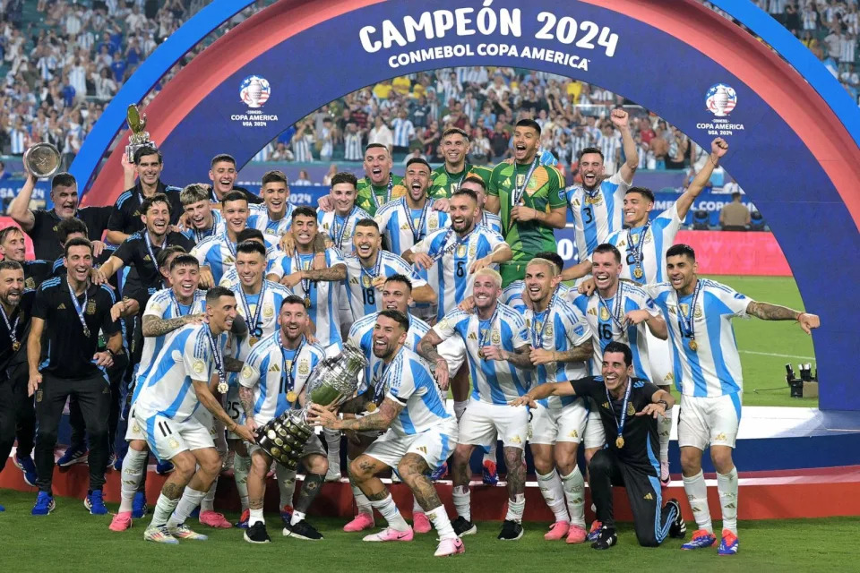 PHOTO: Argentina's forward #10 Lionel Messi lifts up the trophy as he celebrates winning the Conmebol 2024 Copa America tournament final football match between Argentina and Colombia in Miami, FL, July 14, 2024. (Juan Mabromata/AFP via Getty Images)